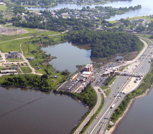 Housing developments, highways and associated automobile pollution, and agriculture are all potential stressors of coastal ecosystems. Photo (above): Joanna Woerner, IAN Image Library. Photo (below): Ben Longstaff, IAN Image Library (www.ian.umces.edu/imagelibrary/)