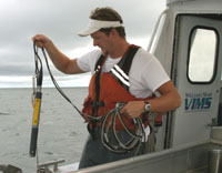 Deploying YSI to collect hydrographic data.