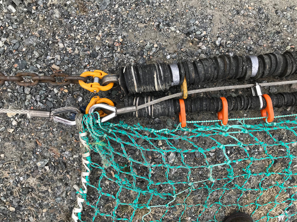 trawl netting with footgear eyes, line eye, end meshes, and hammerlocks with footgear array, bottom swivel plate and bridle connection